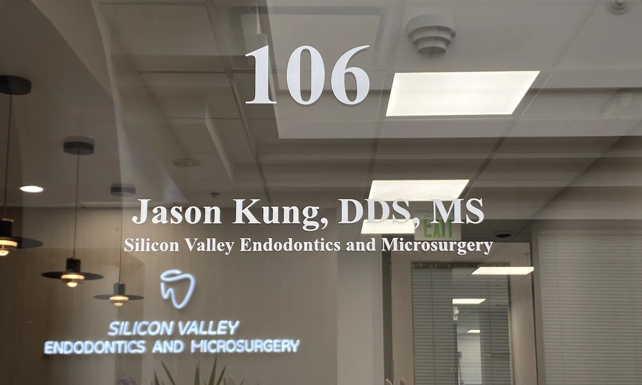 Close-up of glass-door signage reading Silicon Valley Endodontics and Microsurgery, Suite 106